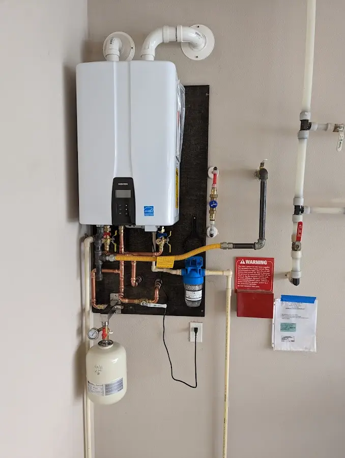 Professional plumber installing copper piping in a Willoughby Hills home